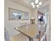 Spacious dining room featuring a large mirror and views into the kitchen at 5528 Palmer Cir # 104, Bradenton, FL 34211