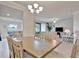 Inviting dining room that connects seamlessly to the living area and boasts stunning golf course views at 5528 Palmer Cir # 104, Bradenton, FL 34211