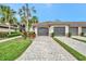 Well maintained home with a brick paved driveway leading to two car garage at 5528 Palmer Cir # 104, Bradenton, FL 34211