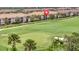 Scenic golf course view with lush green fairways and well-maintained landscaping surrounding the luxurious homes at 5528 Palmer Cir # 104, Bradenton, FL 34211