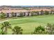 Scenic golf course with tropical palm trees in a golf community with luxury condos and manicured landscaping at 5528 Palmer Cir # 104, Bradenton, FL 34211