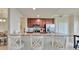 Modern kitchen featuring granite counters, stainless steel appliances, and a breakfast bar at 5528 Palmer Cir # 104, Bradenton, FL 34211