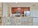 Modern kitchen with stainless steel appliances, granite countertops, and bar stool seating at 5528 Palmer Cir # 104, Bradenton, FL 34211