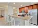 Modern kitchen featuring granite counters, stainless steel appliances, and a breakfast bar at 5528 Palmer Cir # 104, Bradenton, FL 34211