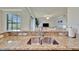 Well-lit kitchen featuring granite countertops, a stainless steel sink, and ample counter space at 5528 Palmer Cir # 104, Bradenton, FL 34211