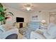Inviting living room with a comfortable sofa, a TV, and an artful accent cabinet, creating a cozy ambiance at 5528 Palmer Cir # 104, Bradenton, FL 34211