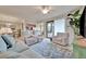 Comfortable living room with plush seating, stylish decor, and easy access to the kitchen and lanai at 5528 Palmer Cir # 104, Bradenton, FL 34211