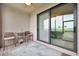 Outdoor patio with comfortable chairs and table overlooking a golf course view at 5528 Palmer Cir # 104, Bradenton, FL 34211