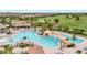 A bird's eye view reveals a stunning resort-style pool featuring a cascading waterfall at 5528 Palmer Cir # 104, Bradenton, FL 34211