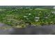 Amazing aerial shot capturing the riverbanks, homes, and surrounding greenery at 5935 River Forest Cir, Bradenton, FL 34203