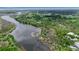 Scenic aerial view of the property with the river and green spaces surrounding it at 5935 River Forest Cir, Bradenton, FL 34203