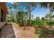 Backyard featuring trees and native landscaping at 5935 River Forest Cir, Bradenton, FL 34203