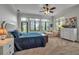 Bedroom featuring a large bed and an outside exit at 5935 River Forest Cir, Bradenton, FL 34203
