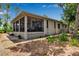 Back side of house with a screened patio and brick lattice at 5935 River Forest Cir, Bradenton, FL 34203