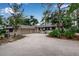 Inviting single-story home with an attached two-car garage and a neatly landscaped front yard at 5935 River Forest Cir, Bradenton, FL 34203