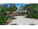 Charming home exterior featuring a brick facade and an attached two-car garage at 5935 River Forest Cir, Bradenton, FL 34203