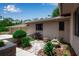 Home exterior with a beautiful lush landscaped walkway and stone tile entryway at 5935 River Forest Cir, Bradenton, FL 34203