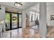 The foyer offers tile floors, stylish decor, and a view of the dining room and porch at 5935 River Forest Cir, Bradenton, FL 34203