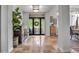 Beautiful foyer showcasing tile floors, stylish decor, and a view of the front porch at 5935 River Forest Cir, Bradenton, FL 34203