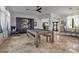 Game room with built-in shelves, a pool table and plenty of natural light at 5935 River Forest Cir, Bradenton, FL 34203