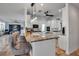 White kitchen with granite countertops, stainless appliances, and a center island with seating at 5935 River Forest Cir, Bradenton, FL 34203