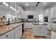 Well-lit kitchen with white cabinetry, granite countertops, and modern appliances at 5935 River Forest Cir, Bradenton, FL 34203