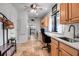 Laundry room featuring a built-in desk, sink, washer and dryer with a coastal design at 5935 River Forest Cir, Bradenton, FL 34203