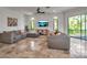 Spacious living room with large windows, tile flooring and comfortable seating at 5935 River Forest Cir, Bradenton, FL 34203