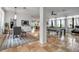 Open-concept living space featuring tile flooring, stylish dining area and a pool table at 5935 River Forest Cir, Bradenton, FL 34203