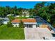 Aerial view of the house with a large backyard, pool, and privacy fence at 5948 Mirror Lake Rd, Sarasota, FL 34238