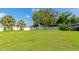Large backyard with lawn and garden shed and privacy fence at 5948 Mirror Lake Rd, Sarasota, FL 34238