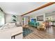 Inviting living room with an open floor plan, cozy seating, and modern decor at 5948 Mirror Lake Rd, Sarasota, FL 34238