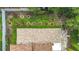 Aerial view of backyard showcasing a brick patio and landscaped garden at 6043 44Th E Ct, Bradenton, FL 34203