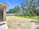 Spacious backyard patio area with brick pavers and lush landscaping at 6043 44Th E Ct, Bradenton, FL 34203