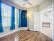 Inviting bedroom features a ceiling fan, hardwood floors, and access to the landing at 6043 44Th E Ct, Bradenton, FL 34203