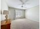 Neutral bedroom featuring carpet, a window with blinds, and a ceiling fan at 6043 44Th E Ct, Bradenton, FL 34203