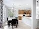 Bright dining area with table and chairs connected to kitchen at 6043 44Th E Ct, Bradenton, FL 34203