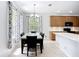 Open-concept dining area with backyard views and seamless access to kitchen at 6043 44Th E Ct, Bradenton, FL 34203