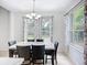 Charming dining room with marble-topped table and views of the landscaped backyard at 6043 44Th E Ct, Bradenton, FL 34203