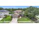 Charming two-story home with a well-manicured lawn, landscaped garden beds, and inviting curb appeal at 6043 44Th E Ct, Bradenton, FL 34203
