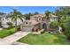 Beautifully landscaped front yard and exterior of a two-story home with an attached garage at 6043 44Th E Ct, Bradenton, FL 34203