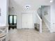 Spacious foyer with stairs, tiled flooring, and double door entryway at 6043 44Th E Ct, Bradenton, FL 34203