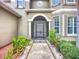 Inviting front entrance with a landscaped walkway leading to the home's front door at 6043 44Th E Ct, Bradenton, FL 34203