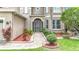 Close up of the front entrance showcasing the front door and landscaping at 6043 44Th E Ct, Bradenton, FL 34203