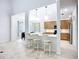 Kitchen featuring breakfast bar, modern appliances, and view of the dining area at 6043 44Th E Ct, Bradenton, FL 34203