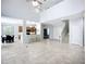 Open living area with views to the kitchen, dining, and staircase at 6043 44Th E Ct, Bradenton, FL 34203