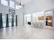 Bright living room featuring high ceilings and access to kitchen and dining area at 6043 44Th E Ct, Bradenton, FL 34203