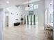 Spacious living room with high ceilings, tile flooring, and lots of natural light at 6043 44Th E Ct, Bradenton, FL 34203