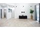 Open-concept living room has high ceilings and tile flooring at 6043 44Th E Ct, Bradenton, FL 34203