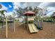Community playground boasts a fun slide, climbing structures, and swings for enjoyment at 6043 44Th E Ct, Bradenton, FL 34203